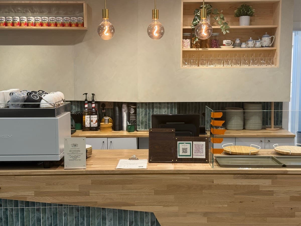 Oak worktop, green bevel tile and the recessed shelving