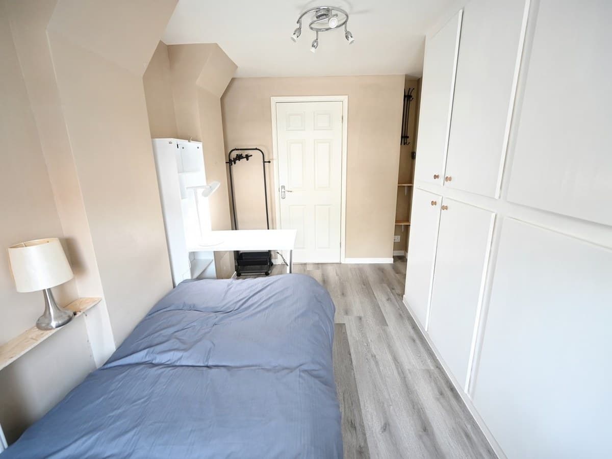 Bedroom — the full-height door wall