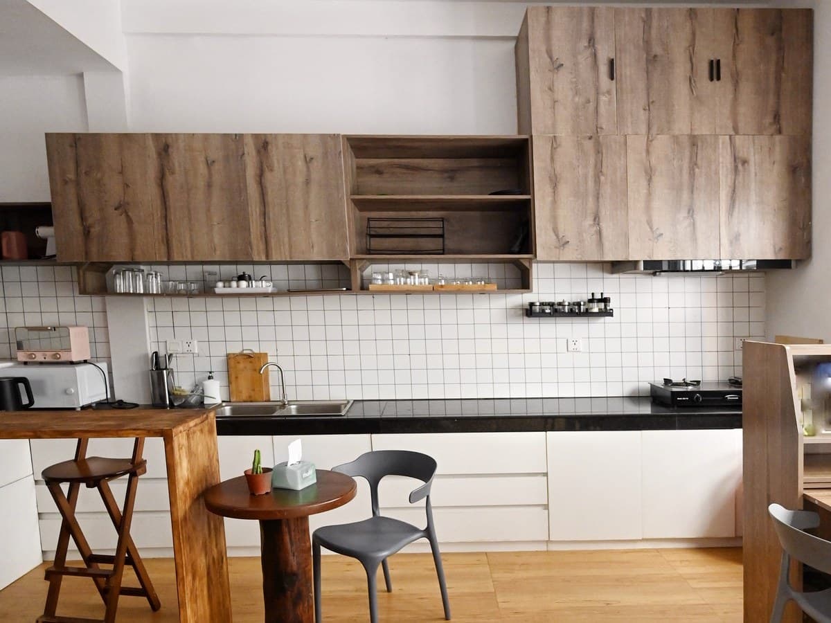 The kitchen run, with the tall fridge built in